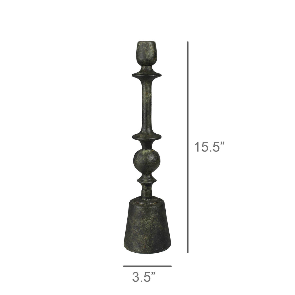The HomArt Bastia Taper Holder, Green Patina - Med, features a vintage-style metal design with a dark green weathered finish, standing 15.5" tall and 3.5" wide—ideal for adding vintage charm to any space.