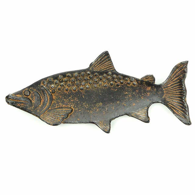 The Vagabond Vintage Cast Iron Fish Dish features engraved scales and fins, a rustic weathered rust finish, and a textured fish shape—adding charm to any table setting.