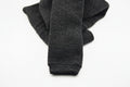 A pair of dark gray, folded Choice Alpaca Products Alpaca Leggings is displayed on a plain white background, known for their temperature regulating and moisture wicking properties.