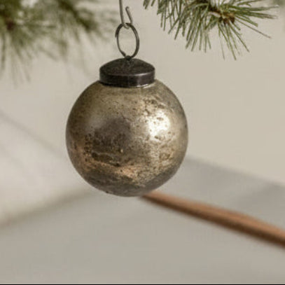 The 2" SILVER CRACKLE KUGEL BLING by Ragon House adds vintage charm to any tree, its antique silver finish reflecting light for an elegant holiday decoration.