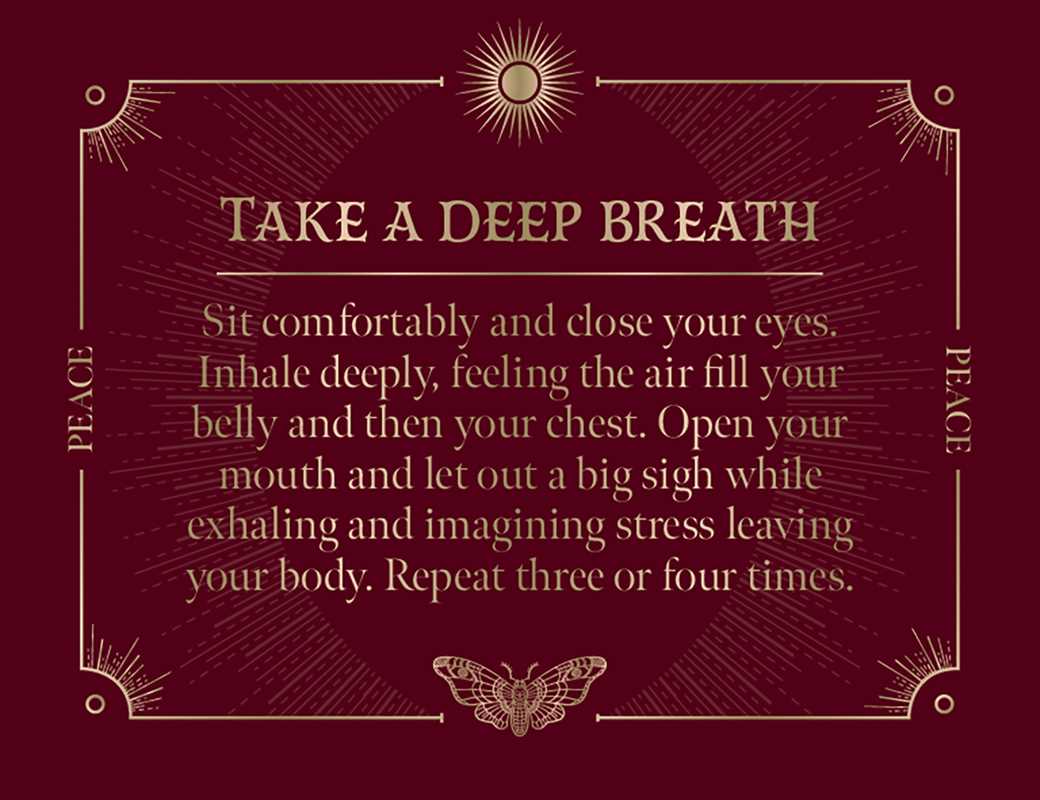 The maroon card with gold accents from Spells: A Little Deck of Enchantments by Lorriane Anderson (Simon & Schuster) reads: “Take a Deep Breath. Sit comfortably and close your eyes. Inhale deeply… Let out a big sigh as you exhale, releasing stress and inviting witchy inspiration into your day. Repeat three or four times.”.