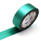 A roll of mt masking tape High Brightness Green metallic washi tape with a portion unrolled.