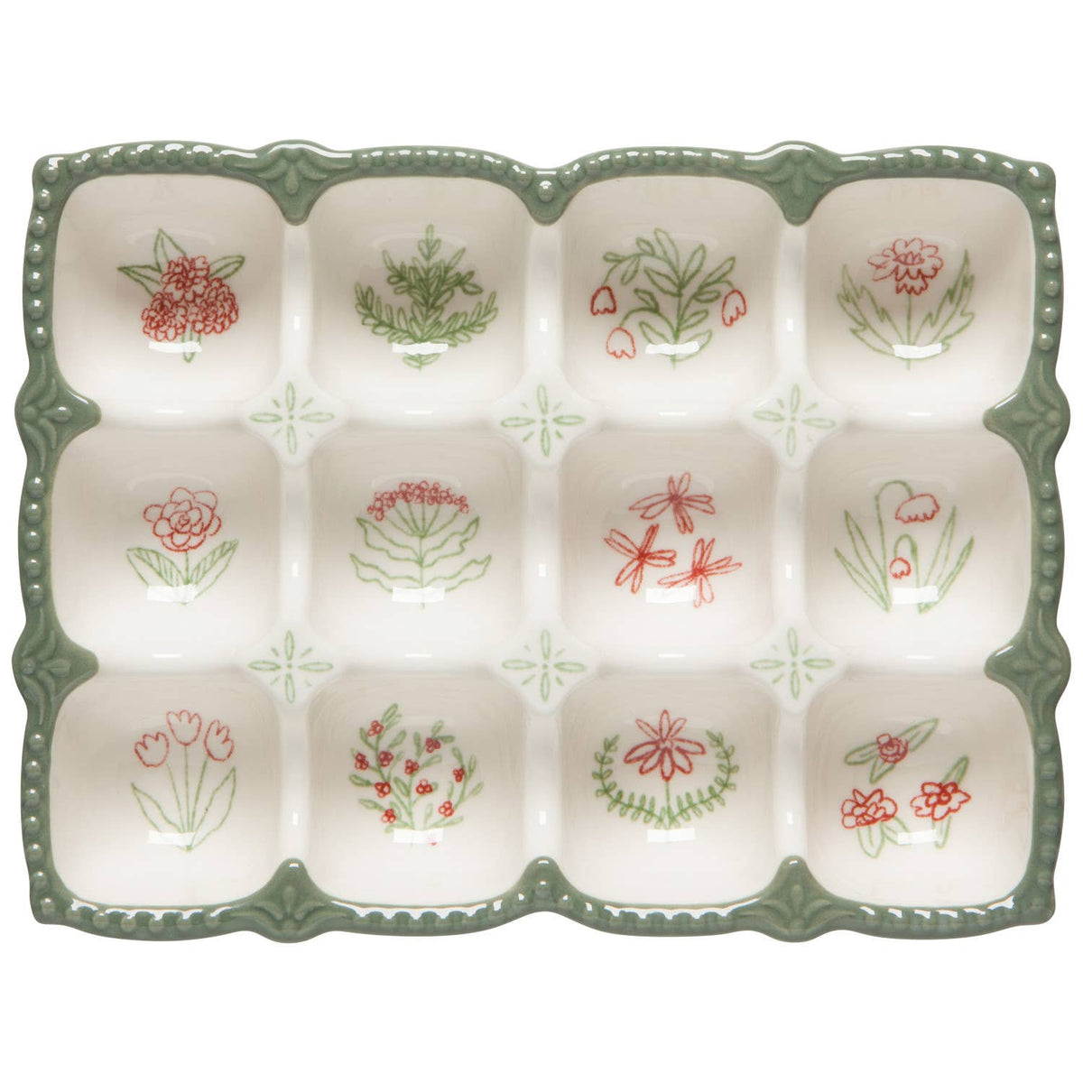 The Camellia Egg Holder by Danica Heirloom is a stoneware crate with green edges and twelve sections, each adorned with red or green hand-drawn flowers, leaves, or dragonflies—ideal for a charming kitchen display.