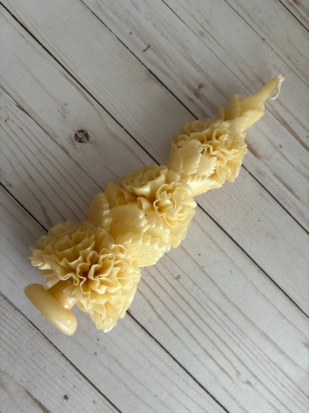 Ivory Large Floral Oaxaca Marigold Day of the Dead Candle shaped like a stack of handmade ivory beeswax marigold blossoms.
