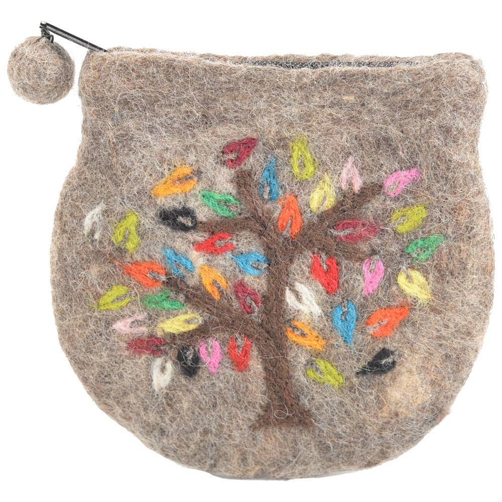 The Benjamin International Tree Of Life Embroidered Change Purse is a small, round brown felt pouch with a zipper, pom-pom top, and colorful leaf-accented Tree of Life embroidery—blending style and function in a unique accessory.