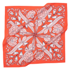 The No. 105 Greta Bandana by Handker Bandanas is a bright red premium cotton accessory with a symmetrical floral design of white and pink roses and leaves, bordered by decorative patterns.