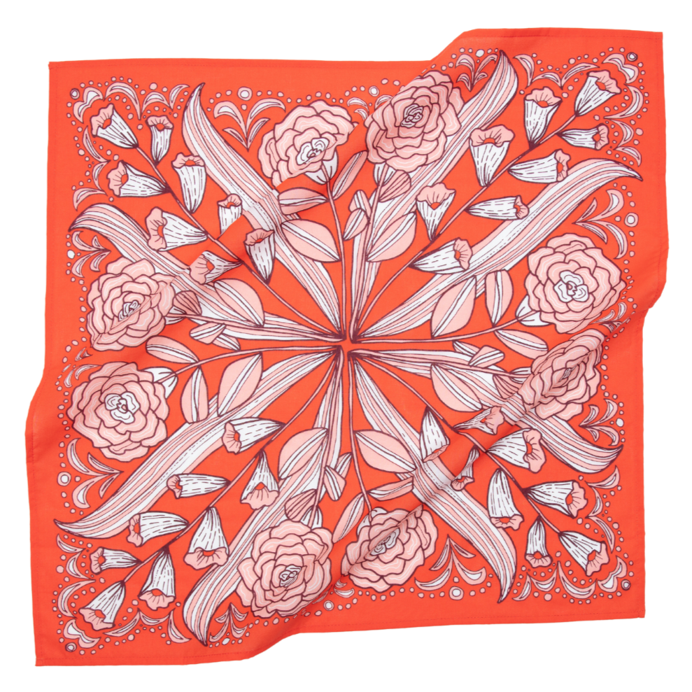 The No. 105 Greta Bandana by Handker Bandanas is a bright red premium cotton accessory with a symmetrical floral design of white and pink roses and leaves, bordered by decorative patterns.