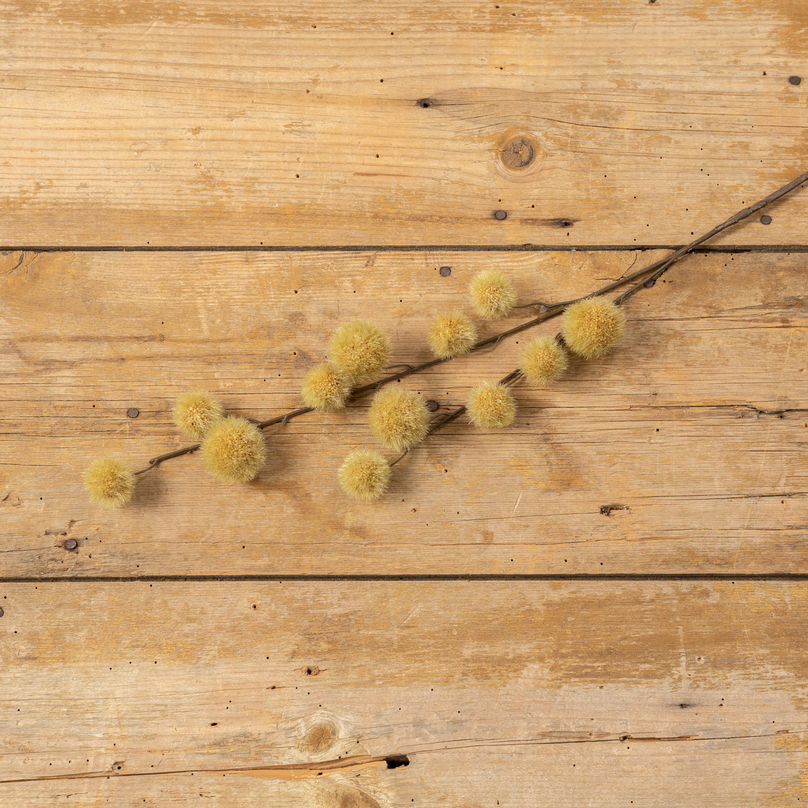 The Ragon House Faux MUSTARD GLOBE THISTLE SPRAY features yellow globe-like accents, bringing a vibrant touch to any arrangement.