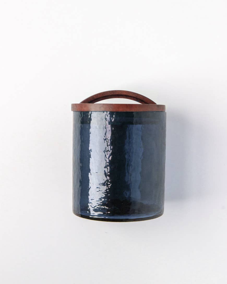 The Handblown Hammered Glass Canisters: Smoke / Medium by Creative Women features textured smokey glass and a hand-carved wooden lid—perfect for stylish, airtight kitchen storage.