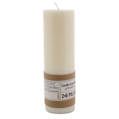 A tall, ivory unscented candle by HomArt, the Pillar 2 x 6, features a brown paper label with product info. Made from paraffin palm wax, it has a visible wick and offers a long burn time.