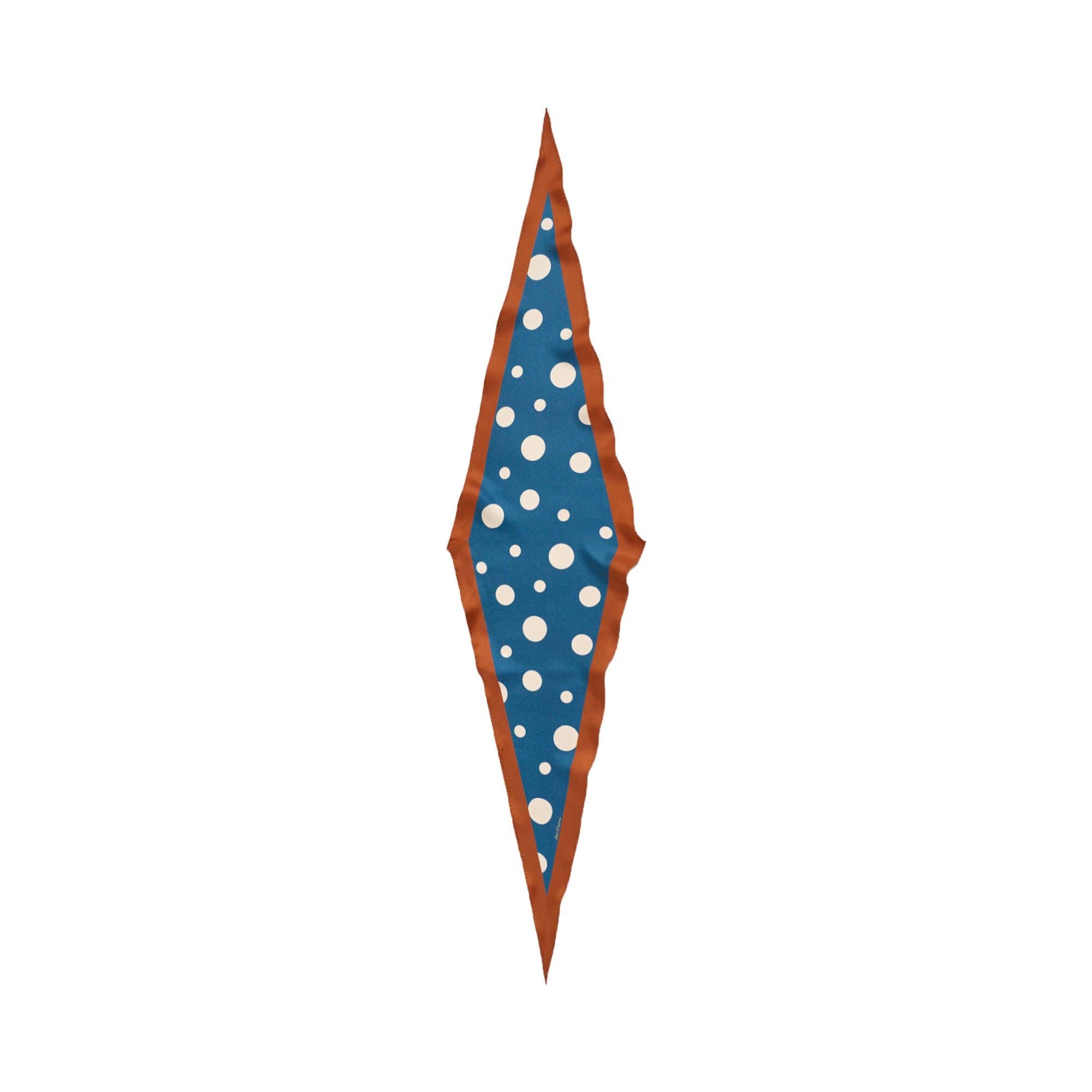 The Lost Pattern NYC Silk Polka Dot Diamond Neckerchief - Salted Caramel features a long diamond shape with an agate grey border, wavy brown edges, and a blue center adorned with white polka dots in various sizes.