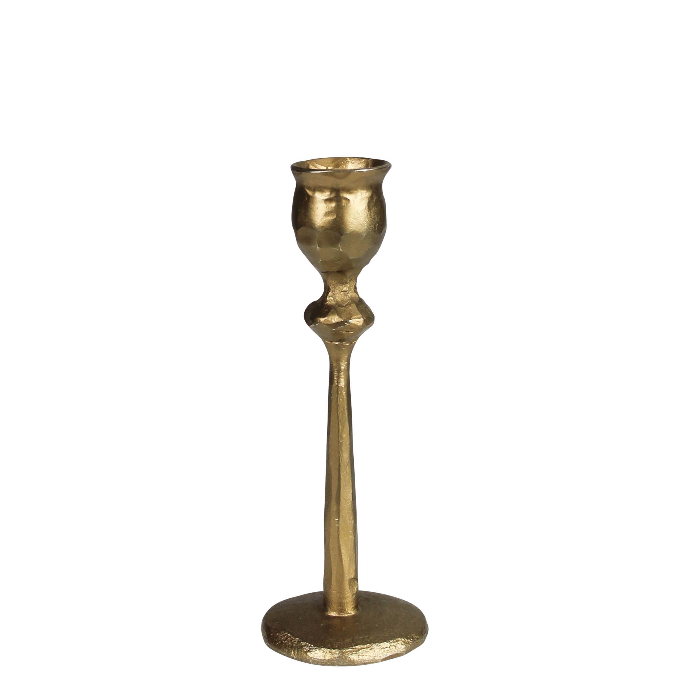 The HomArt Sonrisa Taper Holder, Brass - Sm, is a single fluted metal candlestick holder with a textured surface and wide round base, shown upright on a white background.