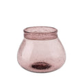The Indaba Trading Recycled Glass Vase, Sangria, features a round, wide-mouthed hand-blown design in light mauve with textured air bubble glass and a flared opening for a modern decorative touch.