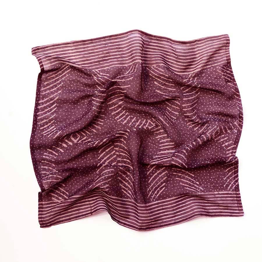 The Ichcha Square Bandana Scarf Artisan Block Print Ladies - Violet is a silk cotton bandana featuring hand block printed white dotted and striped geometric designs, displayed partially wrinkled for a textured look against a white background.