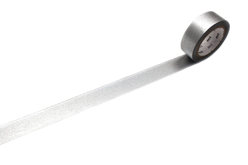 A roll of mt masking tape (Sweet Bella) High Brightness Silver washi tape with a strip unspooled across a white background.