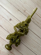 Olive Green Large Oaxaca Marigold Candle, a handmade olive green beeswax taper decorated with sculpted flower clusters along its length.