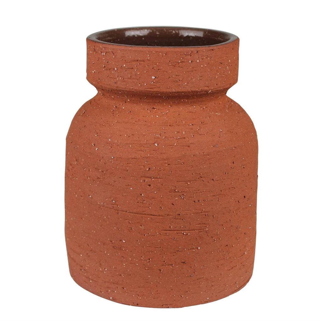 The Kosta Vase by HomArt features a reddish-brown terra cotta cement body with a wide shape, narrow neck, and flared rim. Its textured, speckled exterior has a rough finish, while the darker interior is smooth.