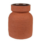 The Kosta Vase by HomArt features a reddish-brown terra cotta cement body with a wide shape, narrow neck, and flared rim. Its textured, speckled exterior has a rough finish, while the darker interior is smooth.