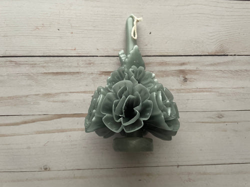 Sage Oaxaca Marigold Day of the Dead Candle, a sage green beeswax taper shaped like a bouquet of marigold flowers.