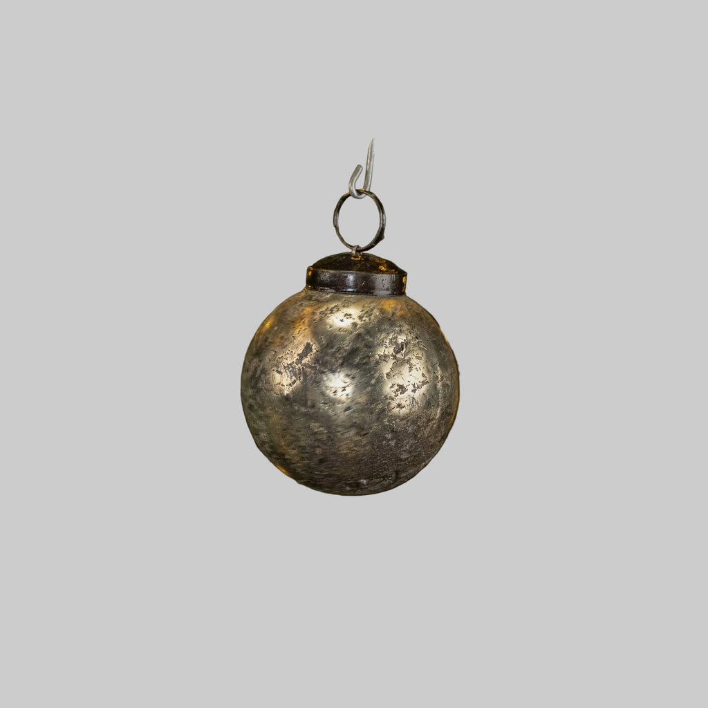 A 2" SILVER CRACKLE KUGEL BLING ornament by Ragon House, featuring a slightly tarnished, textured surface, hangs against a plain light gray background.