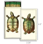 The HomArt Matches - Turtles box features a detailed green and brown turtle illustration on the lid. Measuring 4.5 x 2.25 inches, it's perfect as a charming hostess gift or for adding graphic decor to any space. Shown open and closed.