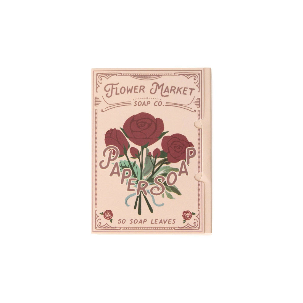 A beige packet labeled 123 Farm Paper Soap – Rose Scent, Travel Size, 50 Sheets features red roses and green leaves. The eco-friendly packaging contains 50 handwashing sheets.