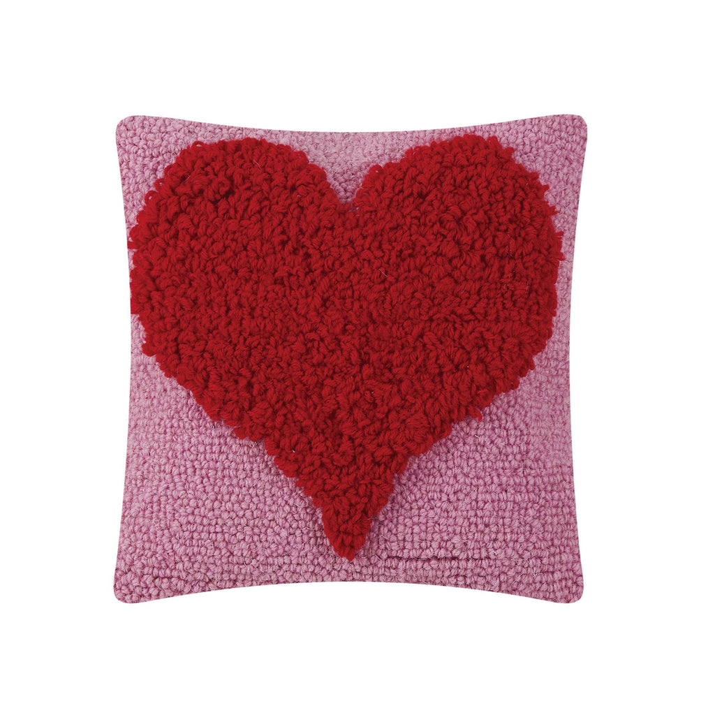 The Peking Handicraft Looped Heart Hook Pillow is a square pink throw pillow with a large textured red heart in the center and a soft velvet backing for comfort.