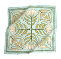 The No. 012 Eliza Bandana by Handker Bandanas features a light blue base with a symmetrical floral design of cream flowers, green leaves, and gold accents on premium cotton, finished with decorative borders.