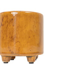 Close-up of the Foreside Home & Garden Glossy Brown Ceramic Planter Pot, resembling a footed vessel, with only its right half visible against a white background.