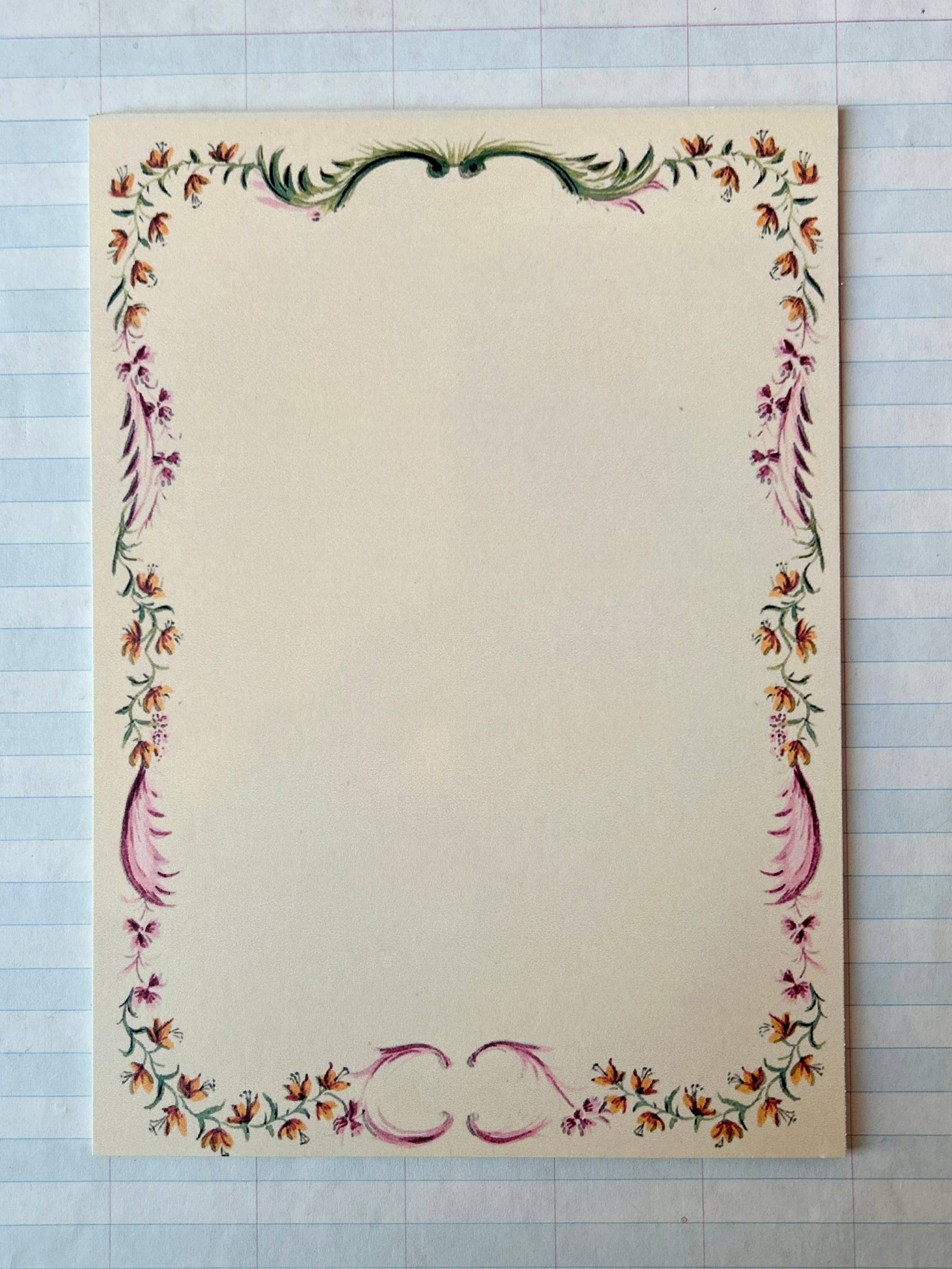 The Parcel French Menu Stationery Set II: 2 includes 8 blank cards on creamy white cardstock, each with a decorative floral border in green, orange, and purple—perfect for personal notes or menus.