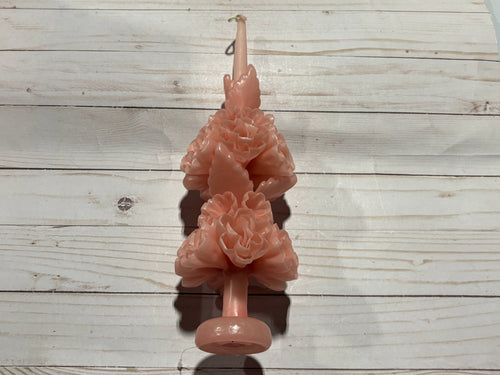A pale pink handmade Rose Quartz Large Oaxaca Marigold Candle sculpted into the shape of two stacked marigold flowers.