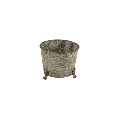 The Silver Tree Home & Holiday A00558 is a 5.5in round metal planter with an antique galvanized finish, gray textured sides, and three short decorative cast iron feet, shown on a white background.