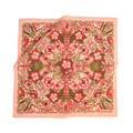 The No. 500 Sylvia Bandana by Handker Bandanas is a 22x22 inch square silk scarf, featuring a pink border and vibrant red, pink, and green floral pattern with symmetrical flowers and leaves. "Handker Bandanas" accents the lower right corner.