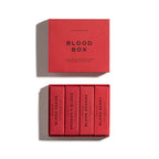 THE BLOOD BOX by Heretic Parfum features four plant-based, blood-inspired scents—Blood Cedar, Dragon’s Blood, Blood Orange, and Blood Berry—all in red packaging for an immersive fragrance experience.