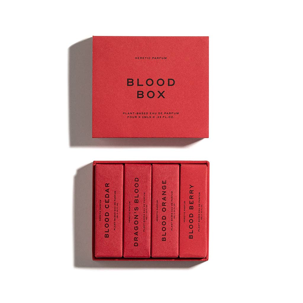 THE BLOOD BOX by Heretic Parfum features four plant-based, blood-inspired scents—Blood Cedar, Dragon’s Blood, Blood Orange, and Blood Berry—all in red packaging for an immersive fragrance experience.