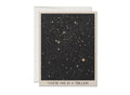 The One in a Trillion greeting card by Red Cap Cards features a starry night sky on heavyweight cardstock with “YOU’RE ONE IN A TRILLION” on the front. Includes an envelope.