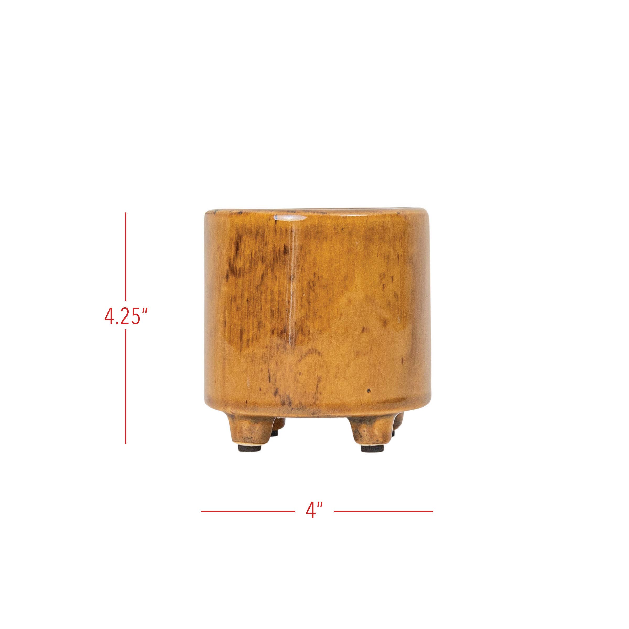 The Foreside Home & Garden Glossy Brown Ceramic Planter Pot is a small, cylindrical planter with a brown reactive glaze and three feet, measuring 4.25" tall by 4" wide, shown with red lines indicating its dimensions.