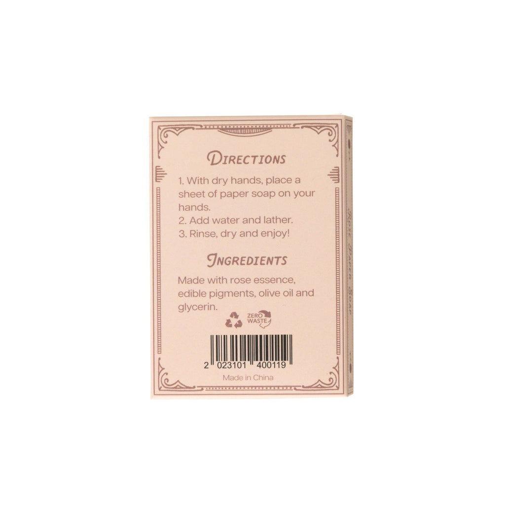 The image shows the back of a pink 123 Farm Paper Soap – Rose Scent, Travel Size, 50 Sheets box. Directions: place one eco-friendly handwashing sheet on your hands, add water, lather, rinse, and dry. Contains rose essence and olive oil.
