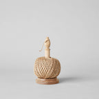 The Gardener's Planting Set by Bloomist features a spool of natural twine on a wooden base with a vertical holder and knob, ideal for use with gardening tools like floral scissors, shown against a plain light gray background.