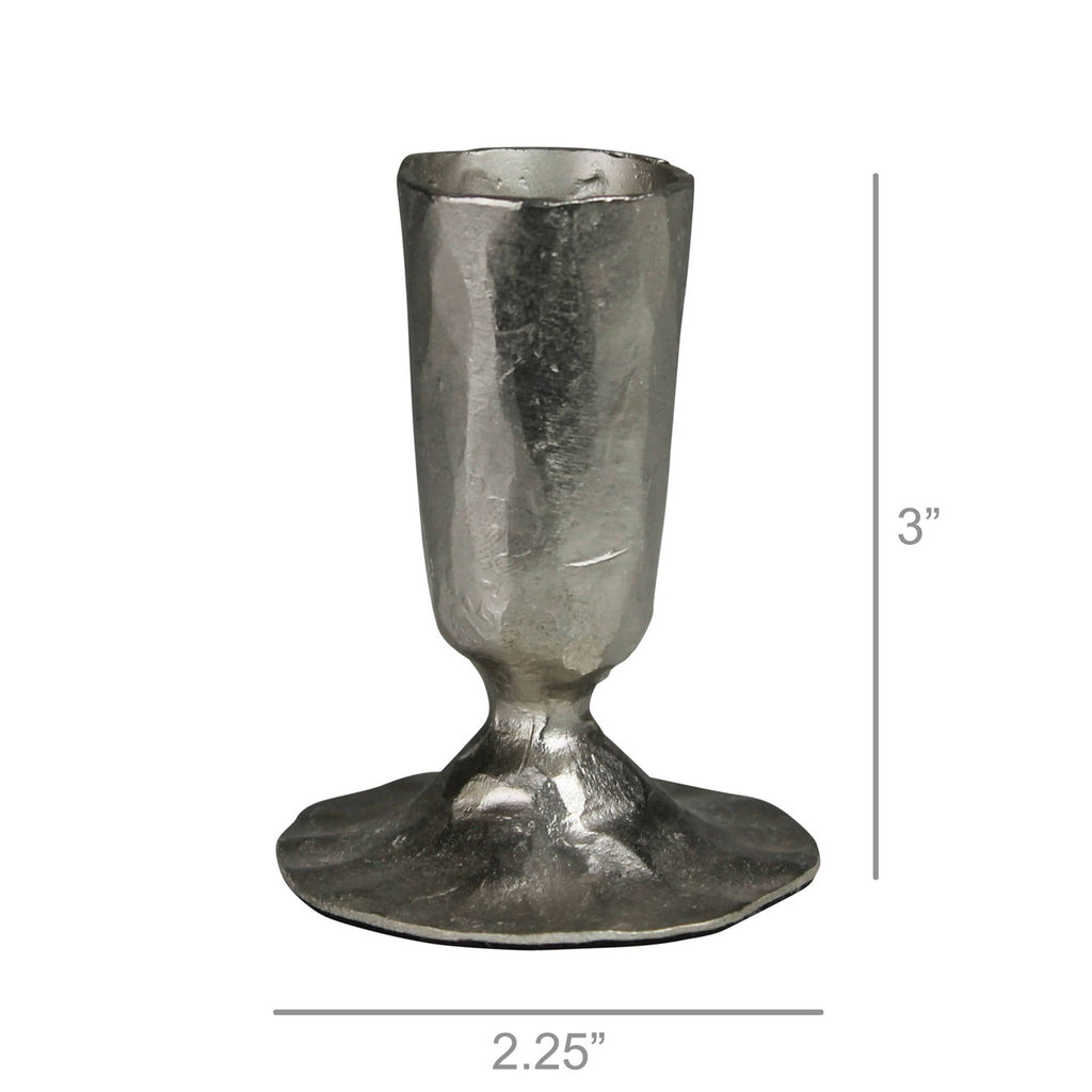 The Jon Candlestick by HomArt is a handcrafted, nickel-plated metal holder with a hammered texture. Silver-toned, it stands 3" tall and 2.25" wide at the base, featuring an artisanal, irregular look.