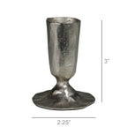 The Jon Candlestick by HomArt is a handcrafted, nickel-plated metal holder with a hammered texture. Silver-toned, it stands 3" tall and 2.25" wide at the base, featuring an artisanal, irregular look.