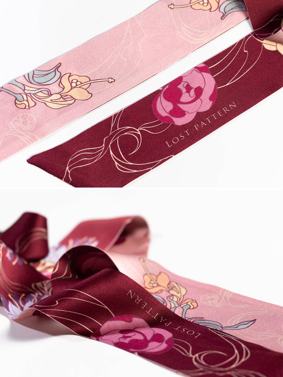 A close-up of the Lost Pattern NYC Silk Skinny Scarf - Ruby Red, featuring floral patterns in pink, burgundy, and gold tones with "LOST PATTERN" printed on the burgundy section. Ideal as a stylish hair accessory or headband.
