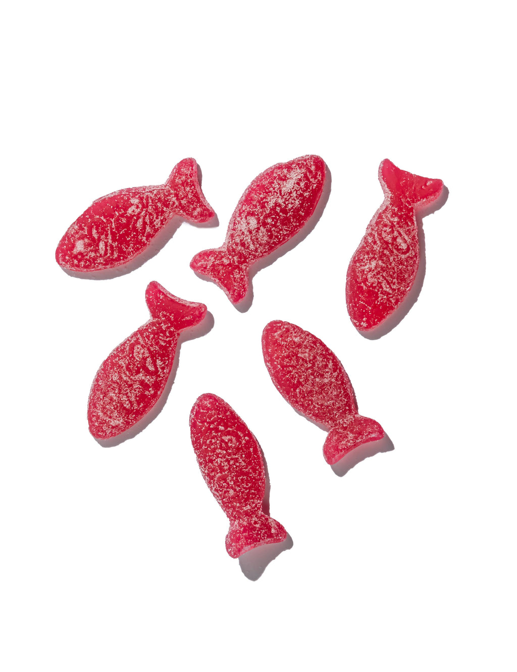 Six red, fish-shaped BonBon Sour Wild Strawberry Fish candies, sugar-coated and vegan, are arranged on a white background. Each offers a tangy wild strawberry flavor.