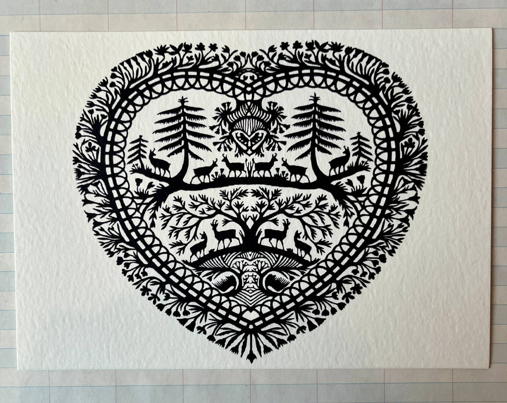 Parcel Papercut Heart Art Cards feature a black and white heart with animals and trees on a 5x7 card, paired with a creamy white envelope.