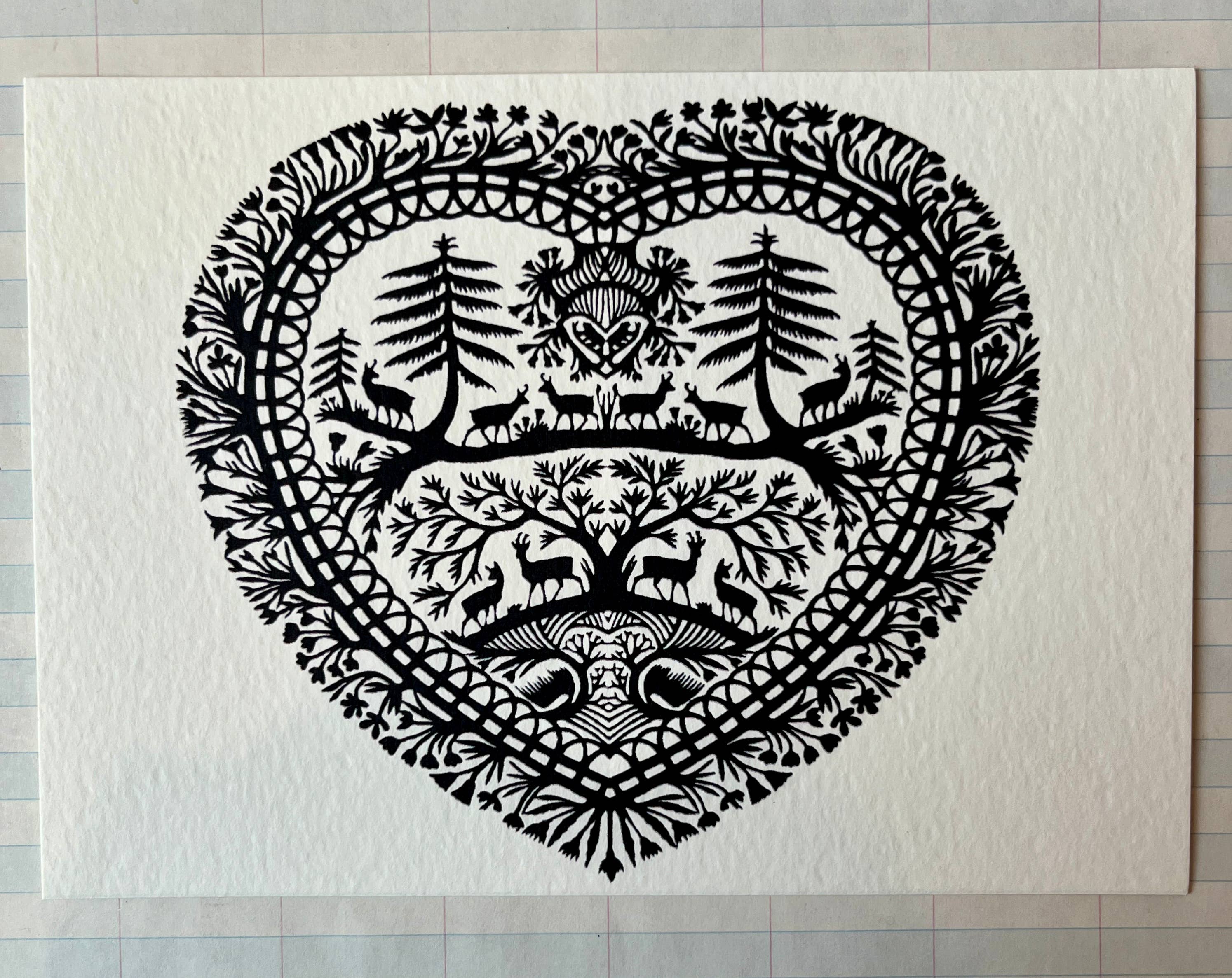 Parcel Papercut Heart Art Cards feature a black and white heart with animals and trees on a 5x7 card, paired with a creamy white envelope.