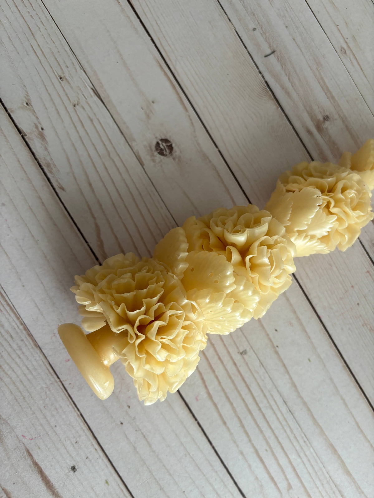 Ivory Large Floral Oaxaca Marigold Day of the Dead Candle handmade in an ivory color and molded into a stack of ruffled marigold flowers.
