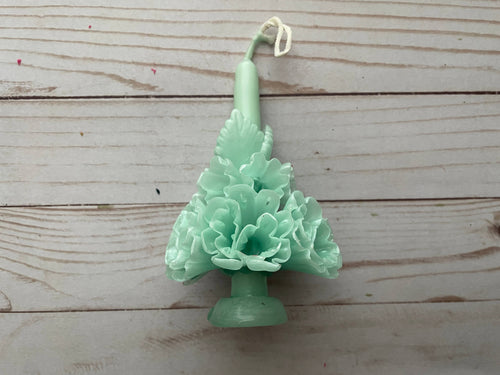 Mint Oaxaca Marigold Day of the Dead Candle: a medium-sized pale green beeswax taper candle molded into the shape of a bouquet of marigolds.