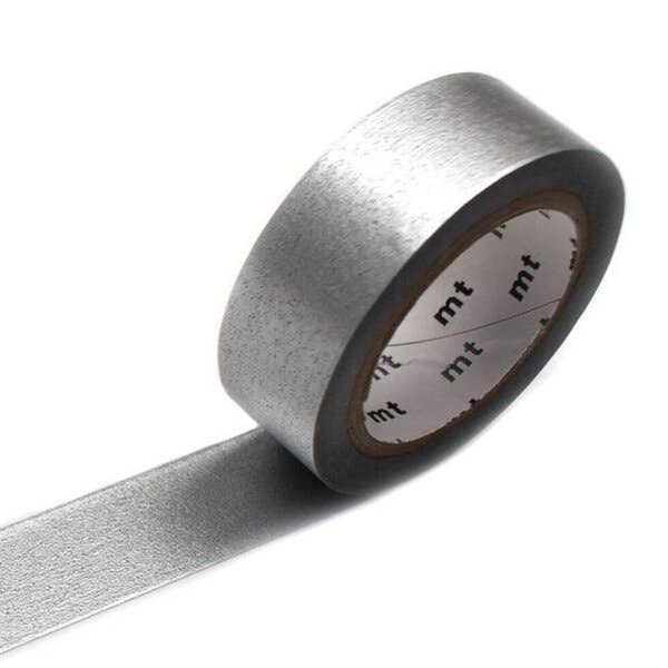 A roll of mt masking tape (Sweet Bella) in High Brightness silver, shown with a strip of the metallic tape extended outward.