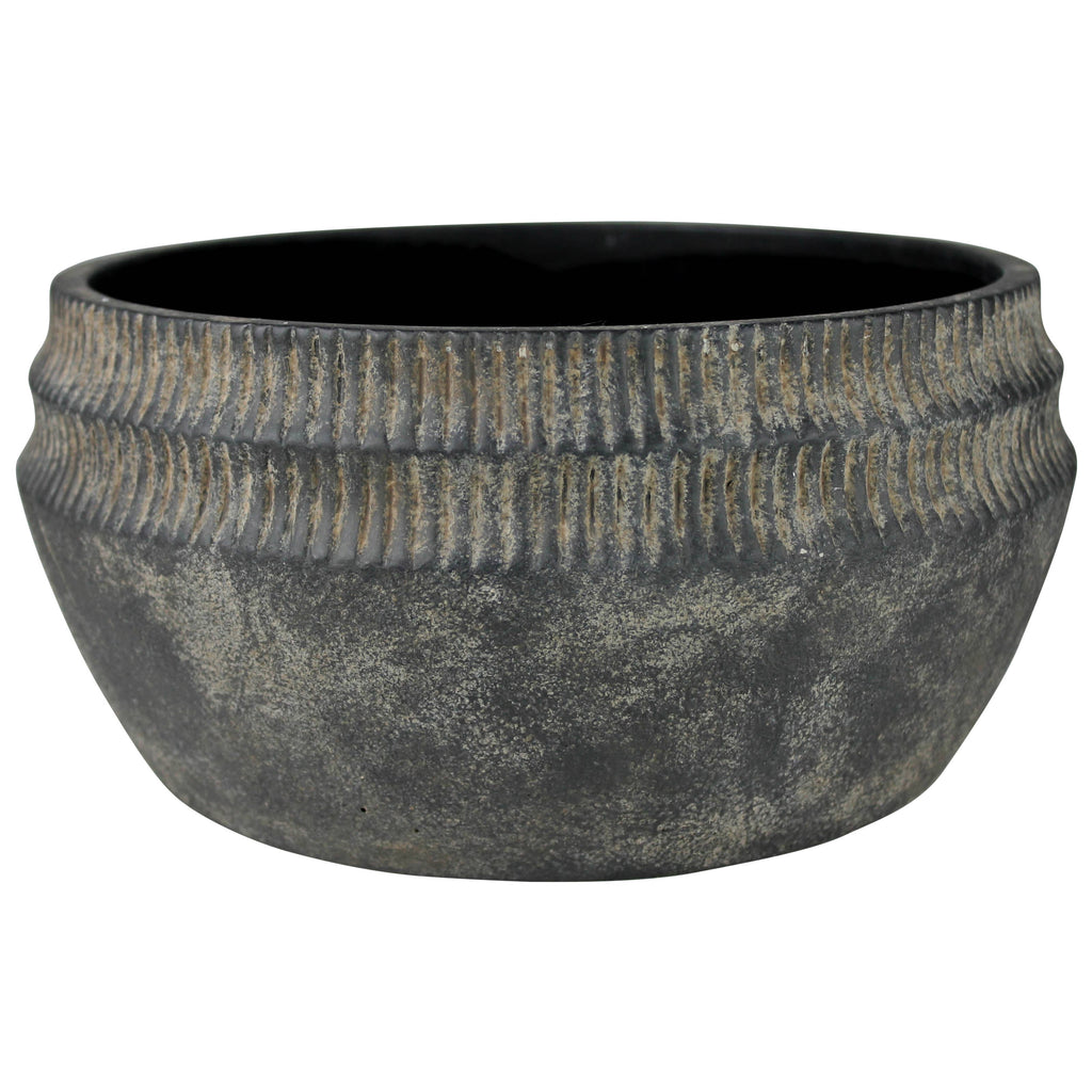 The HomArt Yara Low Planter, Cement - Lrg features a round, wide-mouthed design in dark gray cement with a ribbed upper exterior and matte finish—ideal for rustic garden decor.