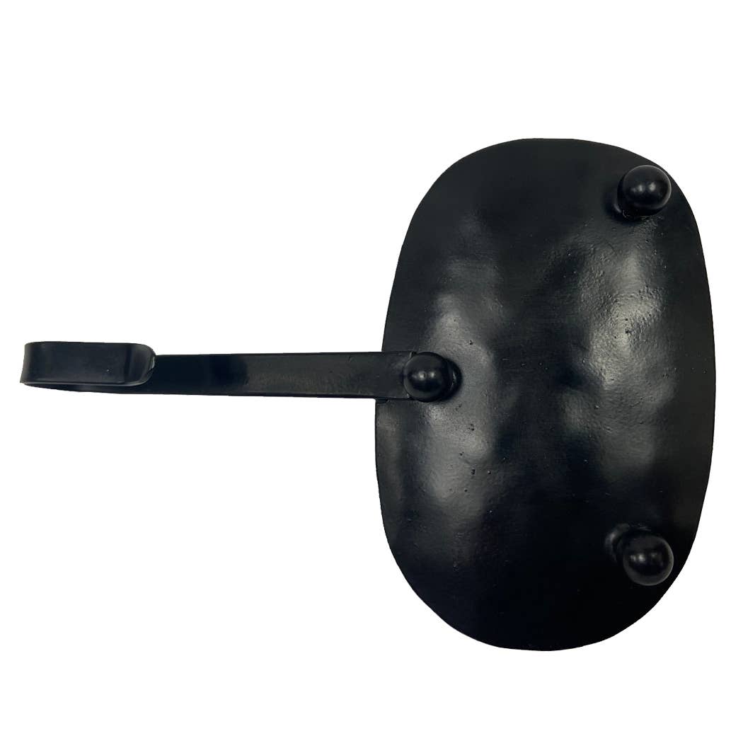 The Iron Chamberstick with Snuffer by Madison Bay Co. - Historical Home Decor Reproductions features a black metal oval backplate with three rounded rivets and a single curved hook, evoking early American vintage charm.